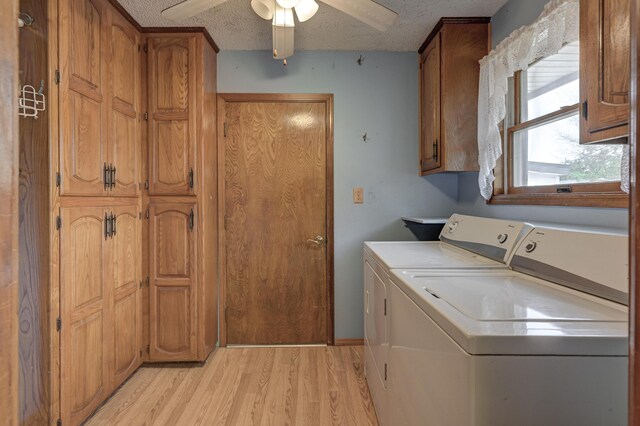3623 Ridge Dr, Joplin, MO 64801 - laundry area with washing machine and dryer, light wood-type flooring, a textured ceiling, a ceiling fan, and cabinet space