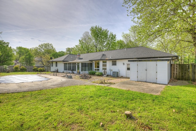 3623 Ridge Dr, Joplin, MO 64801 - back of house with central air condition unit, a lawn, a patio, and a fenced backyard