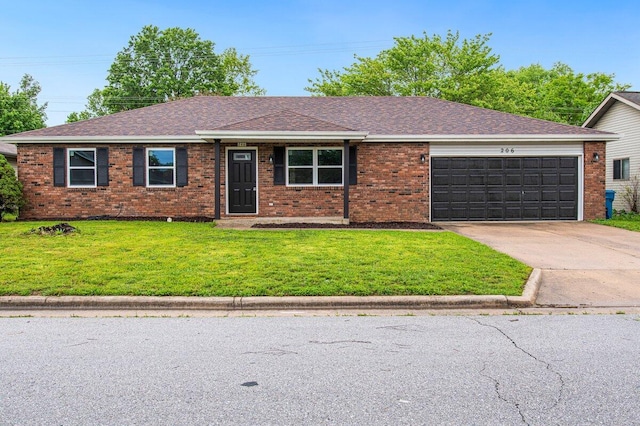 ranch-style house with a front lawn, roof with shingles, brick siding, an attached garage, and driveway