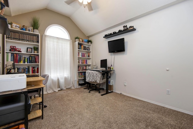 carpeted home office with baseboards, a ceiling fan, and vaulted ceiling