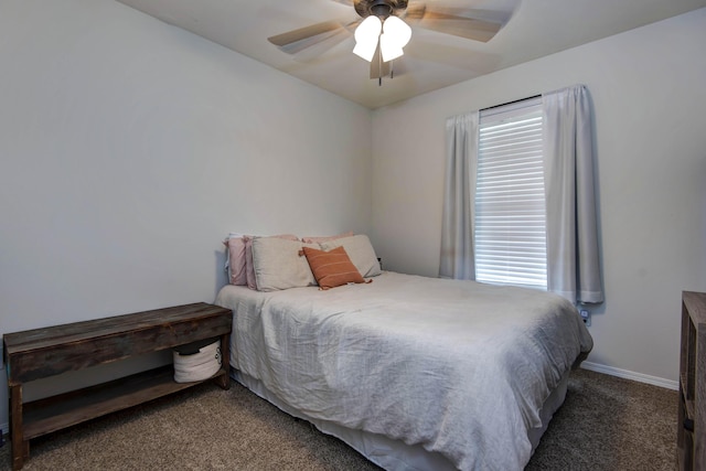 carpeted bedroom with baseboards and ceiling fan