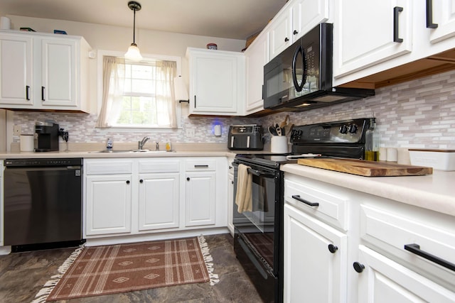 kitchen featuring a sink, white cabinets, black appliances, and light countertops