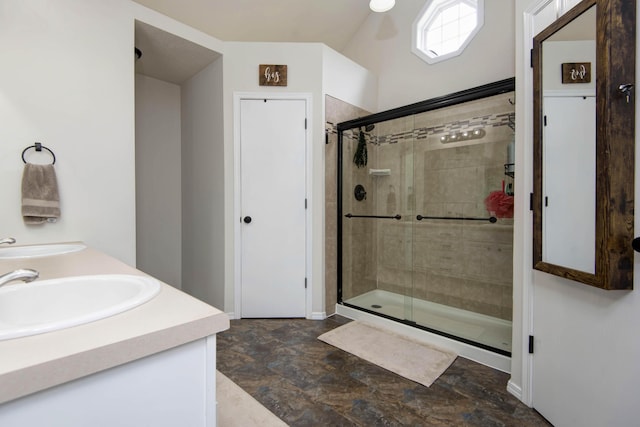 full bathroom featuring a sink, baseboards, and a stall shower