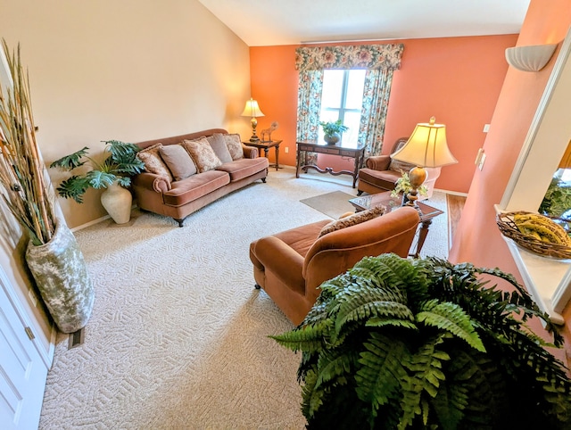 living area with baseboards and carpet flooring