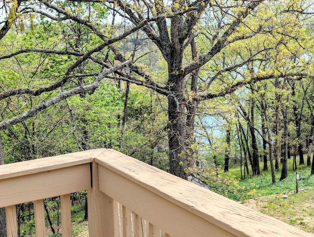 balcony featuring a view of trees