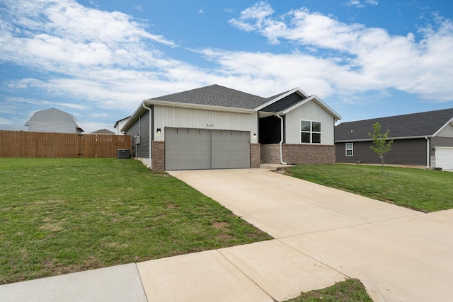 ranch-style home featuring brick siding, an attached garage, fence, and driveway