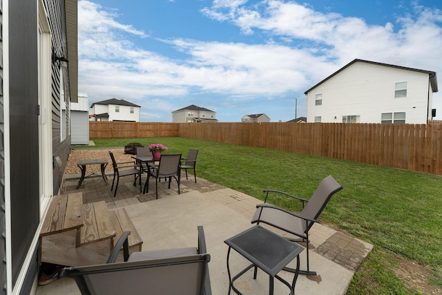 view of patio featuring outdoor dining area and a fenced backyard