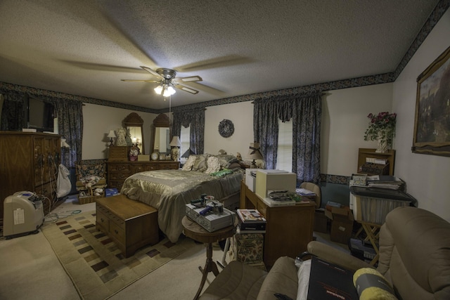bedroom featuring a textured ceiling, ceiling fan, and light carpet