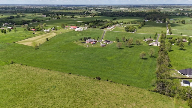 birds eye view of property featuring a rural view