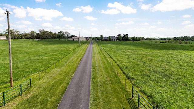 view of street featuring a rural view and aphalt driveway