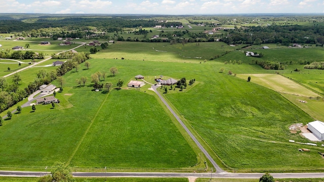 birds eye view of property featuring a rural view