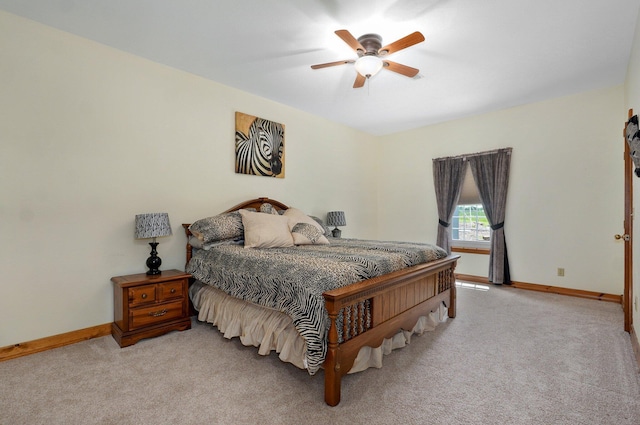 bedroom featuring baseboards, ceiling fan, and carpet floors