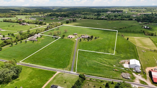 birds eye view of property featuring a rural view