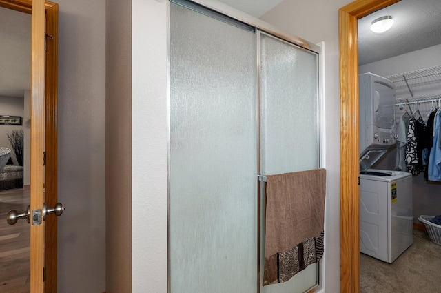 full bathroom with a walk in closet and a stall shower