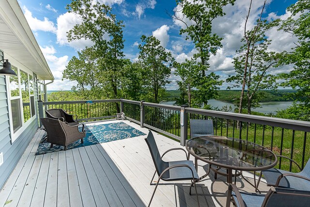 wooden deck featuring a water view