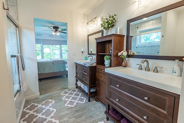 full bathroom featuring ceiling fan, plenty of natural light, ensuite bathroom, and vanity