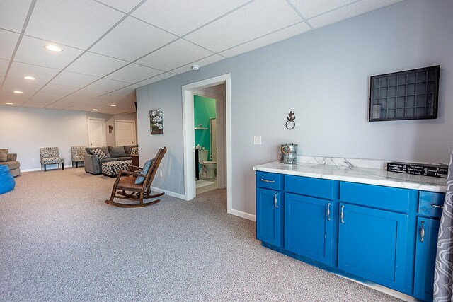 bar featuring light carpet, a paneled ceiling, baseboards, and recessed lighting