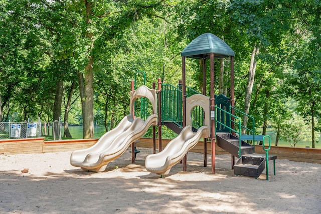 community jungle gym featuring fence