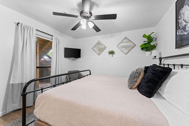 bedroom with ceiling fan and wood finished floors