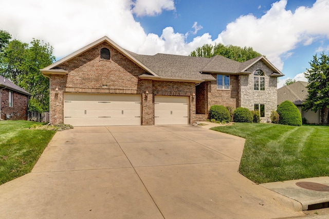view of front of home featuring a garage, a front yard, driveway, and brick siding