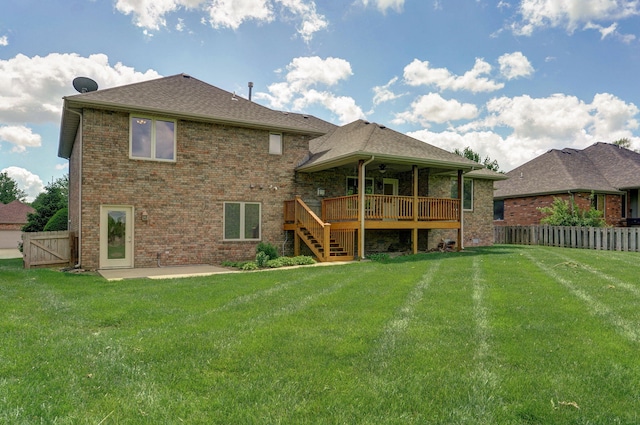 back of property featuring a ceiling fan, a deck, a patio area, a fenced backyard, and stairs