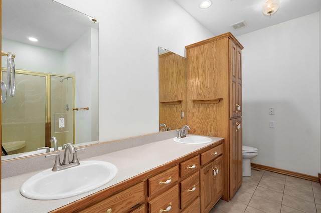 bathroom featuring a sink, tile patterned flooring, toilet, and visible vents