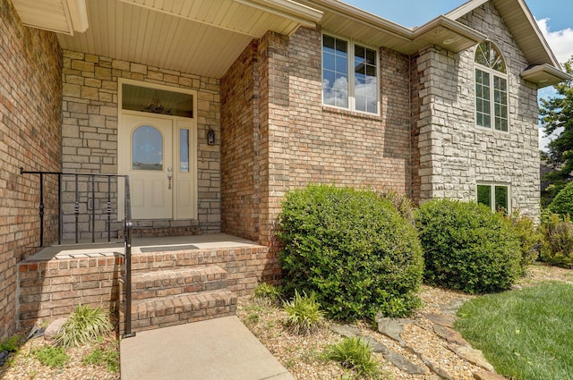 property entrance with brick siding