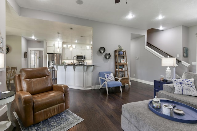 living room with a ceiling fan, dark wood-style flooring, stairway, baseboards, and recessed lighting