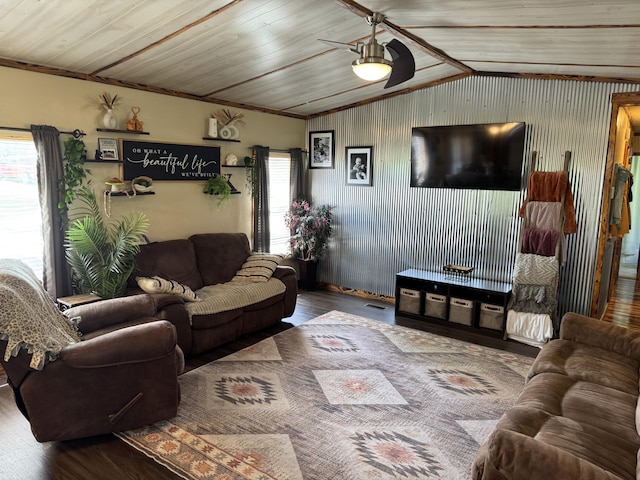 living area featuring plenty of natural light, a ceiling fan, and wood finished floors