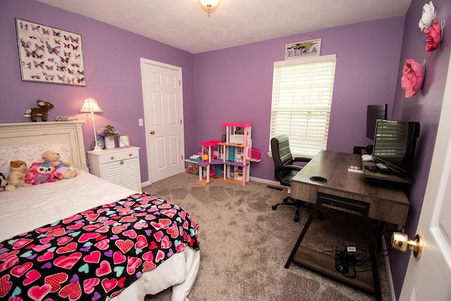 bedroom featuring baseboards and carpet flooring