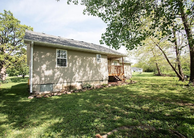 view of side of home featuring crawl space and a lawn