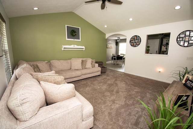 living room featuring recessed lighting, vaulted ceiling, carpet floors, arched walkways, and a ceiling fan