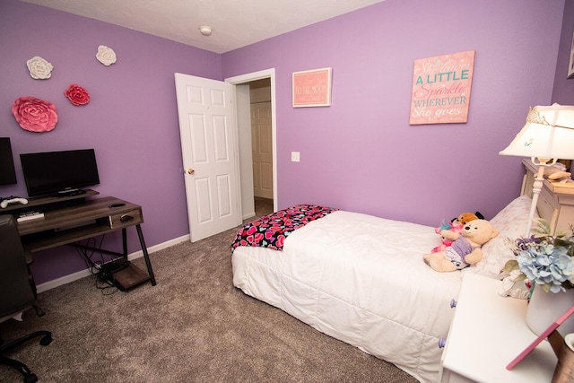 carpeted bedroom featuring baseboards