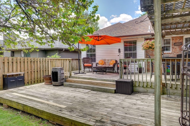 deck with fence and outdoor lounge area