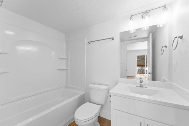 403 Veterans Blvd Unit 203 G6, Branson, MO 65616 - bathroom featuring shower / bathtub combination, toilet, visible vents, vanity, and wood finished floors