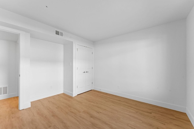 403 Veterans Blvd Unit 203 G6, Branson, MO 65616 - spare room featuring baseboards, light wood-type flooring, and visible vents