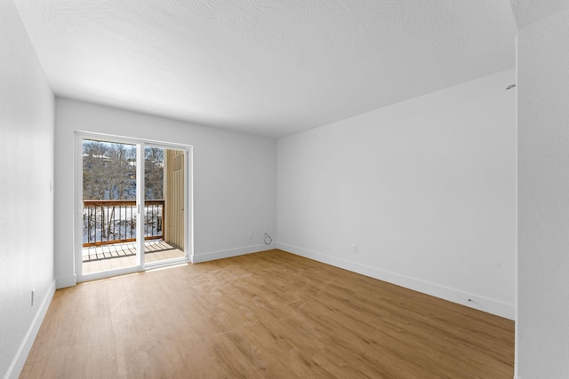 403 Veterans Blvd Unit 203 G6, Branson, MO 65616 - empty room featuring baseboards and light wood-style flooring