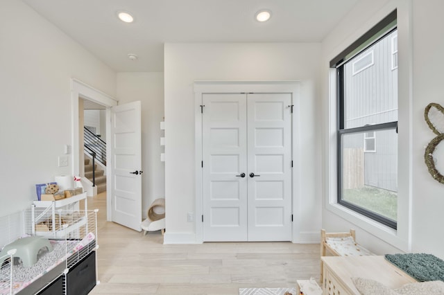 interior space with baseboards, recessed lighting, and wood finished floors