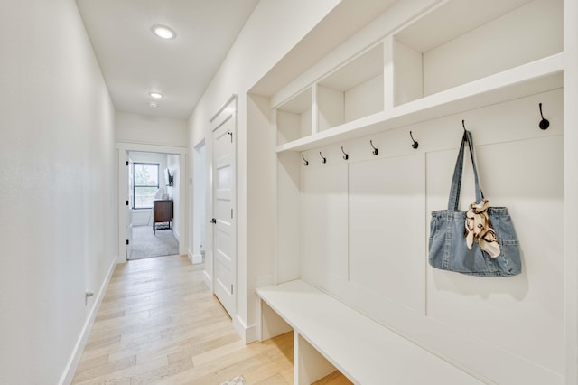 mudroom featuring light wood-type flooring, baseboards, and recessed lighting