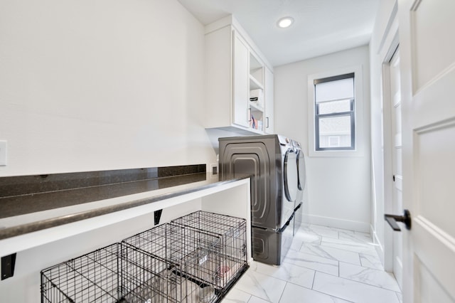laundry area featuring washing machine and dryer, laundry area, baseboards, marble finish floor, and recessed lighting