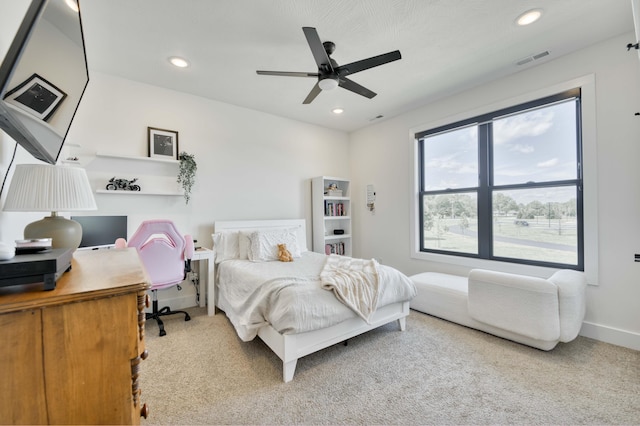 bedroom with baseboards, recessed lighting, carpet flooring, and visible vents