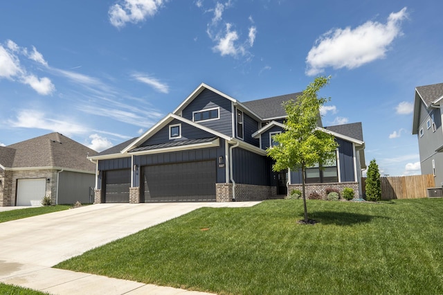 craftsman house with board and batten siding, brick siding, fence, concrete driveway, and a front yard