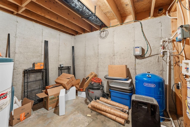 unfinished basement featuring water heater