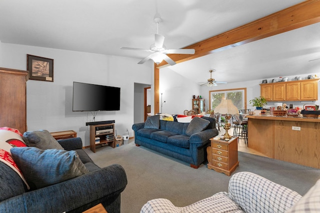 carpeted living room featuring ceiling fan and vaulted ceiling with beams
