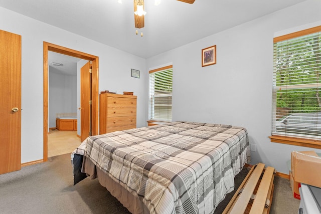 bedroom featuring ceiling fan, carpet, and baseboards