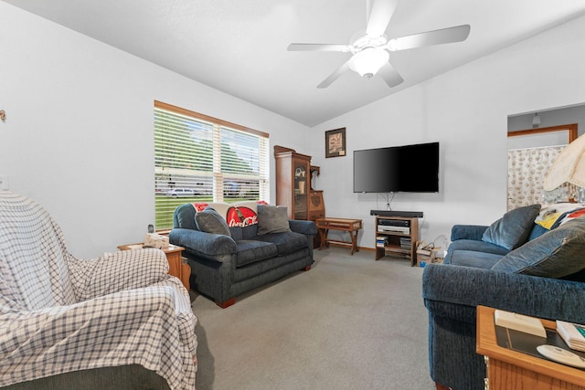 carpeted living room with lofted ceiling and a ceiling fan