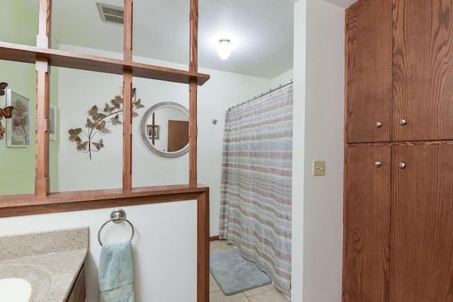 full bath featuring visible vents, tile patterned flooring, vanity, and a shower with curtain