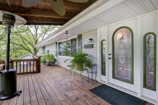 wooden deck with ceiling fan