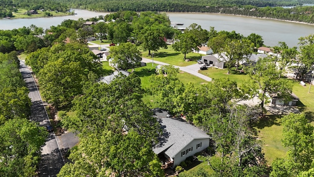 bird's eye view with a forest view and a water view