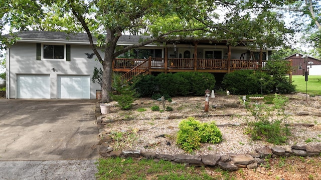 26742 Royal Point Dr, Shell Knob, MO 65747 - ranch-style home with covered porch, driveway, a garage, and stairway